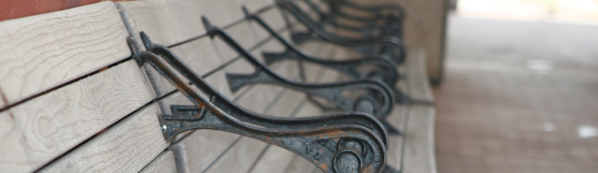 Row of empty wooden seats.